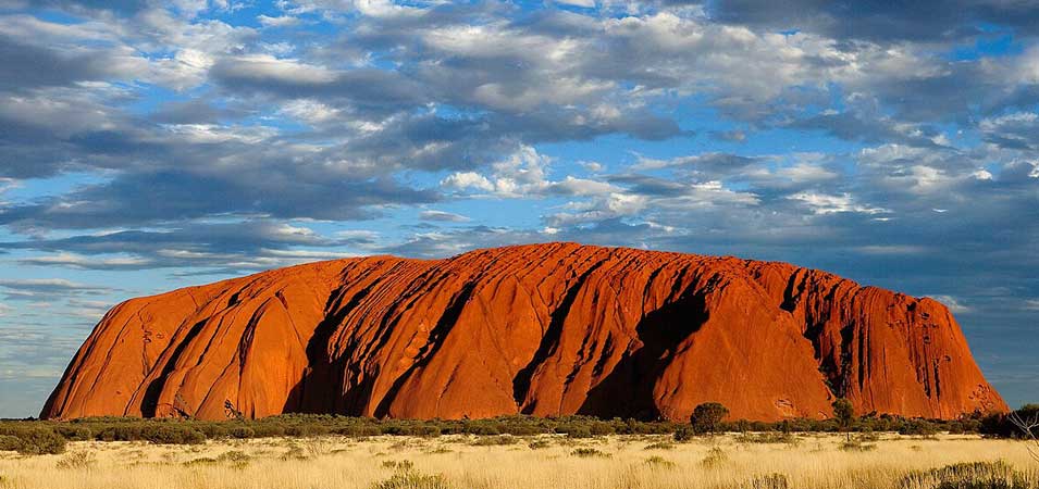 Uluru glowing red at sunset in Australia’s Northern Territory